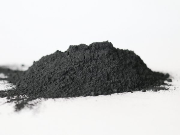 A pile of amorphous graphite is displayed.