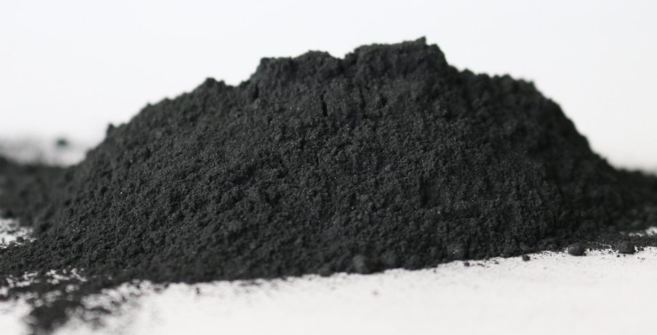A pile of amorphous graphite is displayed.