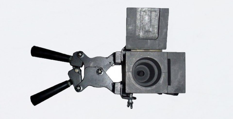 A well-assembled exothermic welding mold with an open cover