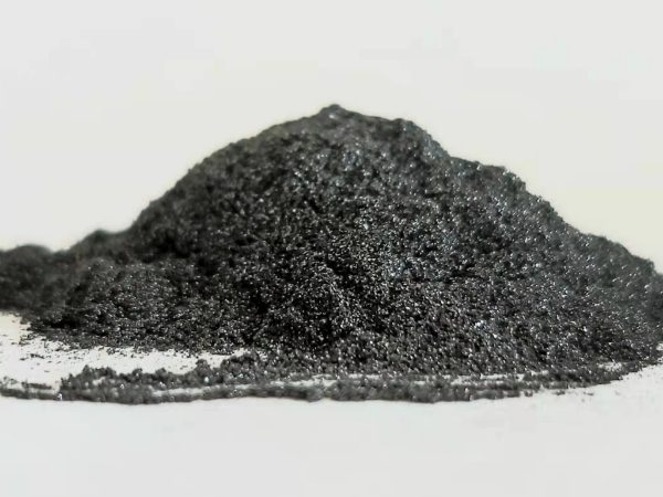 A pile of graphite powder is placed on the desk.