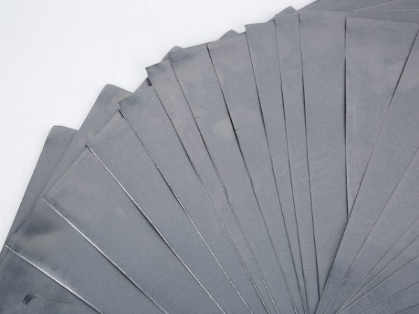Flexible graphite papers are displayed in a fan-shape.