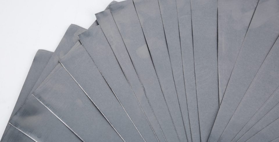 Flexible graphite papers are shown in a fan-shape.