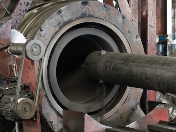 The machine is polishing the inner wall of graphite crucible.