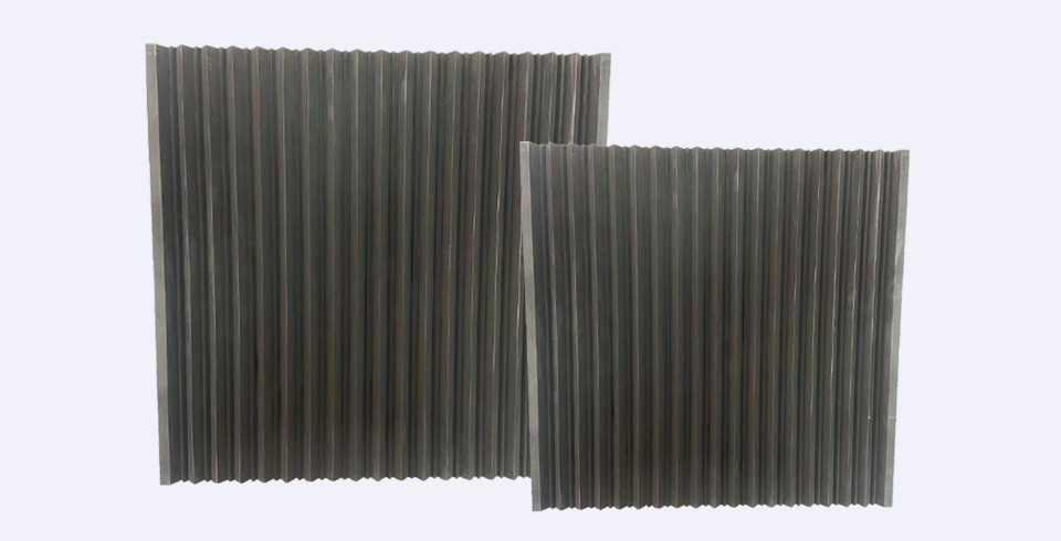 A black graphite groove plate placed on a flat surface