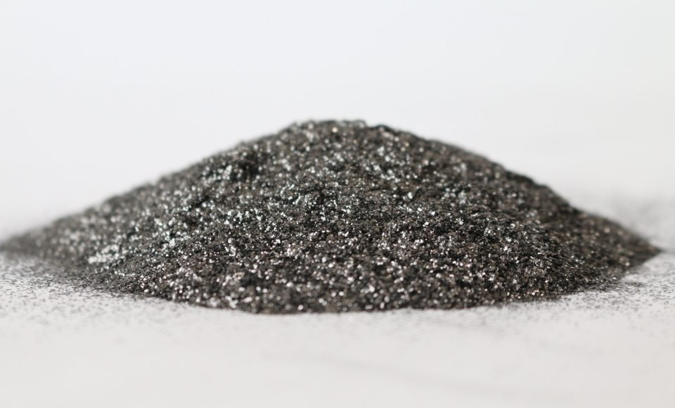 A pile of graphite powder is displayed.