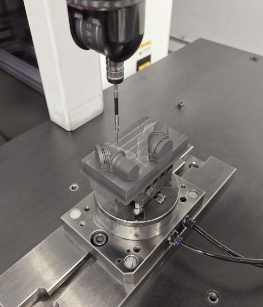 The mechanical equipment is processing the graphite product.