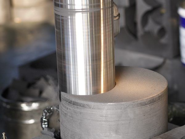 The machine is processing the graphite column.