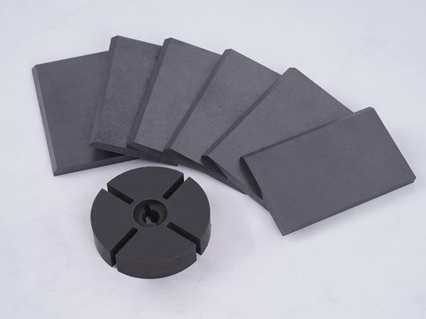 Vacuum pump graphite rotors and vanes are displayed.