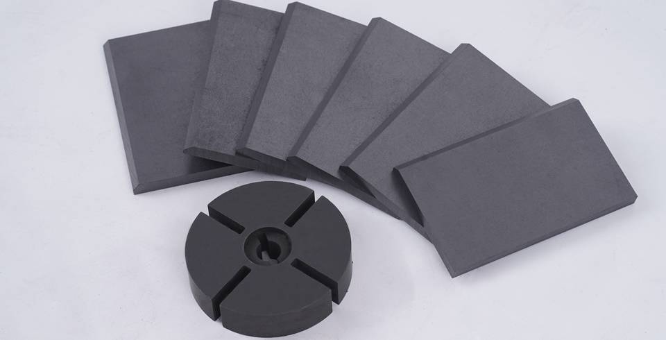 Vacuum pump graphite rotors and vanes are displayed.