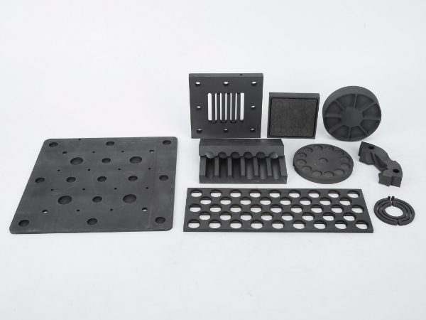 Graphite special-shaped parts of different shapes & sizes are placed together.
