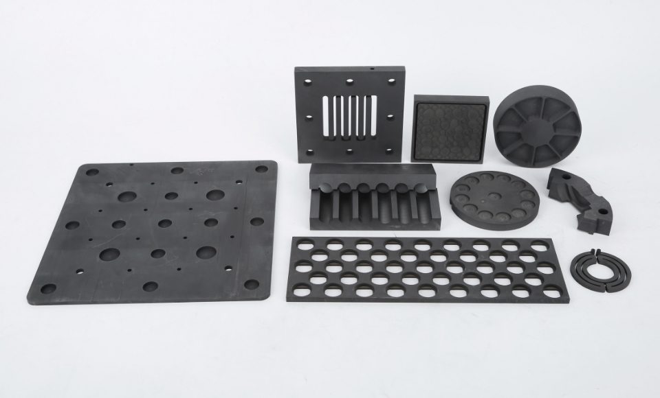 Graphite parts in different shapes and sizes are placed together.