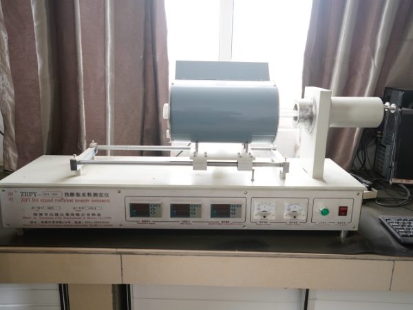 Graphite product thermal expansion coefficient tester is placed next to the window.