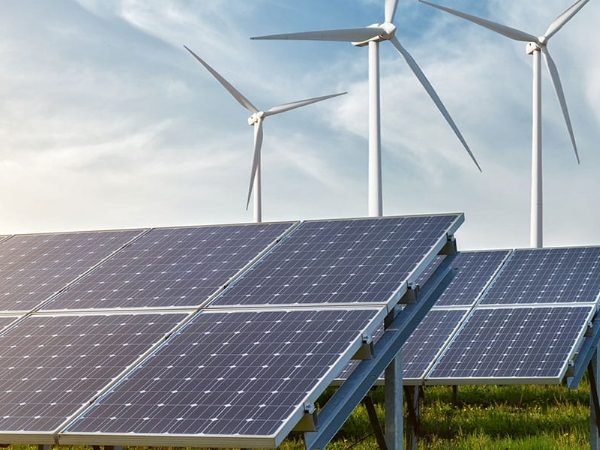 Solar panels and wind turbines under the sunlight